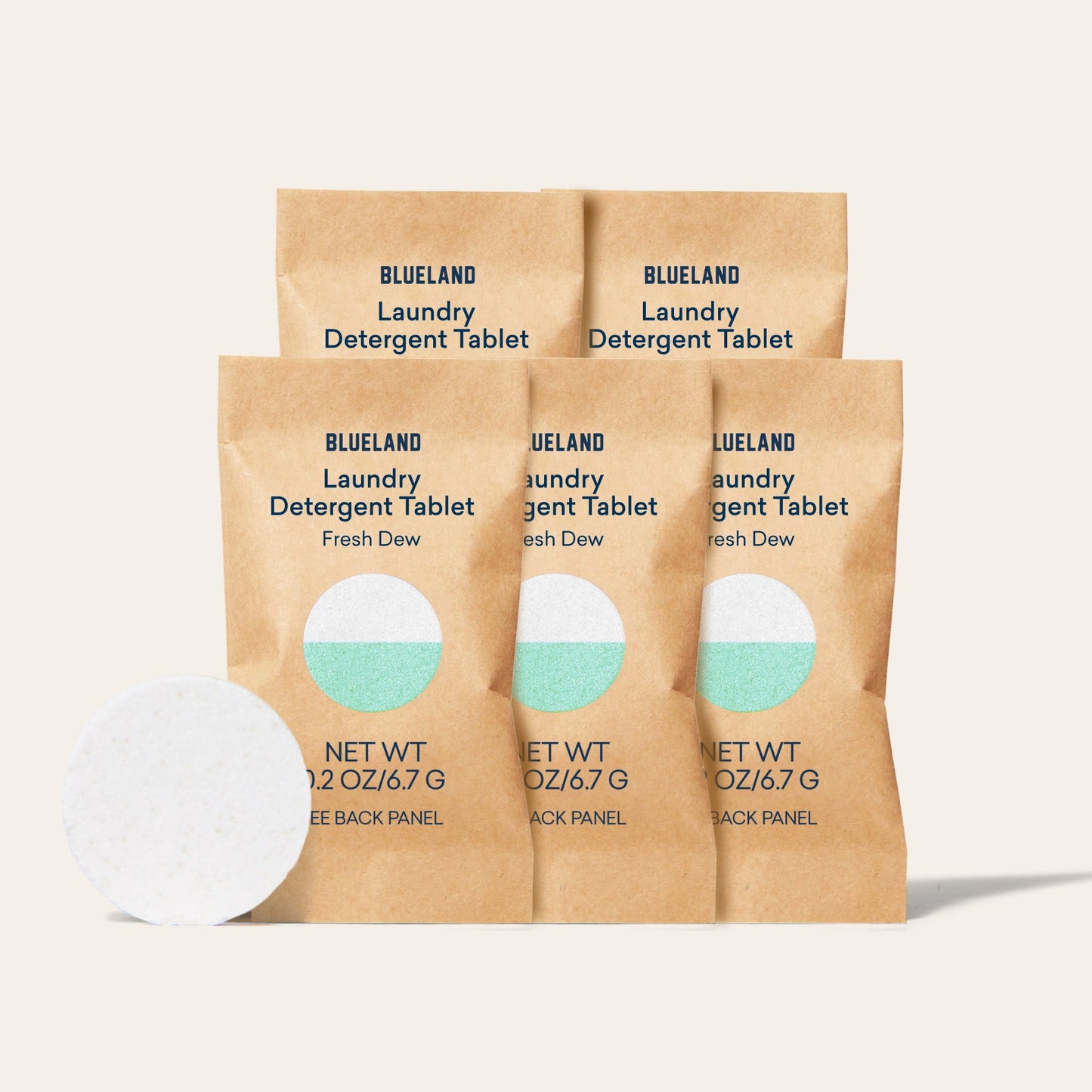 Four brown packets labeled Laundry Detergent Sample Pack (5 Tablets) stand upright, with a white detergent tablet—promising a powerful wash—displayed in front on a light background.